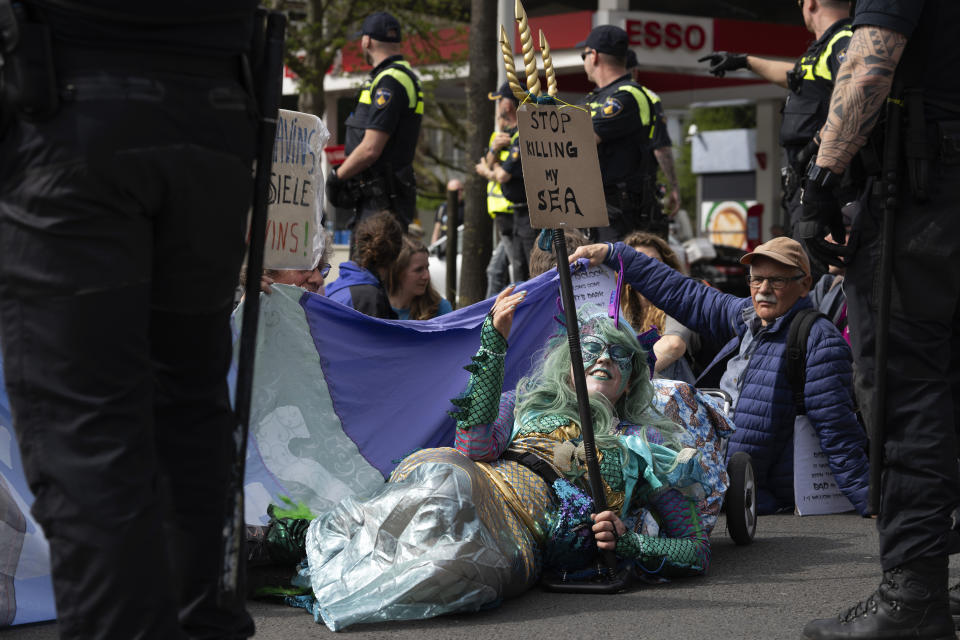 Protestors partially blocked a road during a climate protest of Extinction Rebellion and other activists near the Dutch parliament in The Hague, Netherlands, Saturday, April 6, 2024. (AP Photo/Peter Dejong)