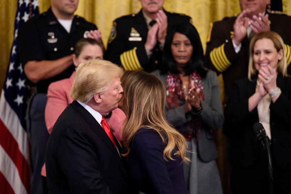 President Donald Trump embracing his wife Melania during their White House event marking the one-year anniversary of their mission to combat the opioid crisis. Source: Getty