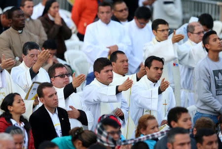 Priests participate in a holy mass celebrated by Pope Francis at Simon Bolivar park in Bogota, Colombia September 7, 2017. REUTERS/Henry Romero