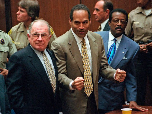 <p>Myung J. Chun/Daily News/AP</p> O.J. Simpson with attorneys, F. Lee Bailey and Johnnie Cochran Jr., after Simpson was found not guilty