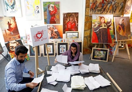 Members of the ArtLords sort letters of Dard-e-Dil project in Kabul