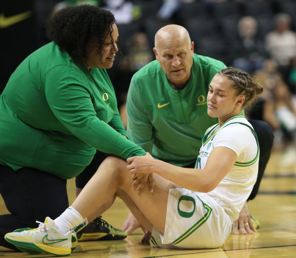 Oregon’s Peyton Scott gets up after being injured during the first half of the Duck’s game against Northern Arizona at Matthew Knight Arena Monday, Nov 6, 2023 in Eugene.