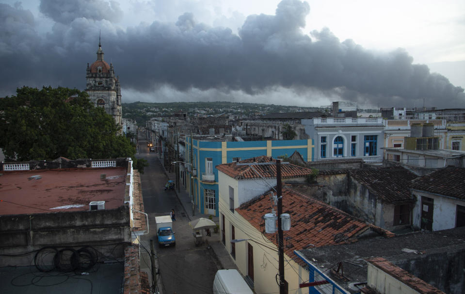 Smoke rises from a deadly fire at a large oil storage facility in Matanzas, Cuba, Tuesday, Aug. 9, 2022. The fire was triggered when lighting struck one of the facility’s eight tanks late Friday, Aug. 5th. (AP Photo/Ismael Francisco)