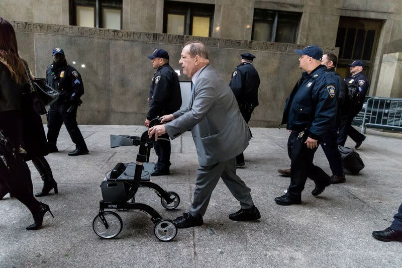 FILE PHOTO: Film producer Harvey Weinstein leaves the New York Criminal Court as the jury continues to deliberate for his sexual assault trial in the Manhattan borough of New York