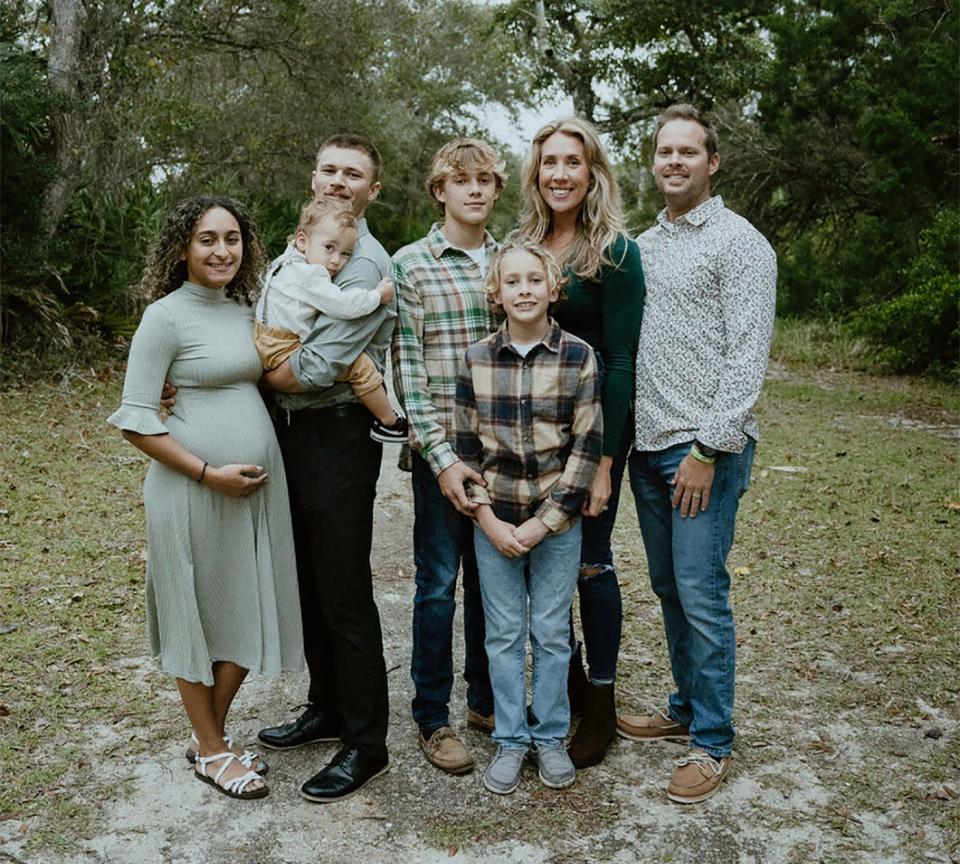 Family portrait: Brittany and Shawn Glisson (right) with daughter-in-law Andreya (from left) and sons Logan, Asher and Gavin. Logan is holding son Uriah.