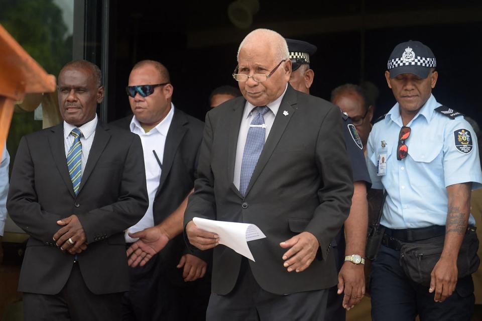 Solomon Islands' newly elected Prime Minister Jeremiah Manele (L) and Governor-General David Vunagi come out of Parliament House (AFP via Getty Images)