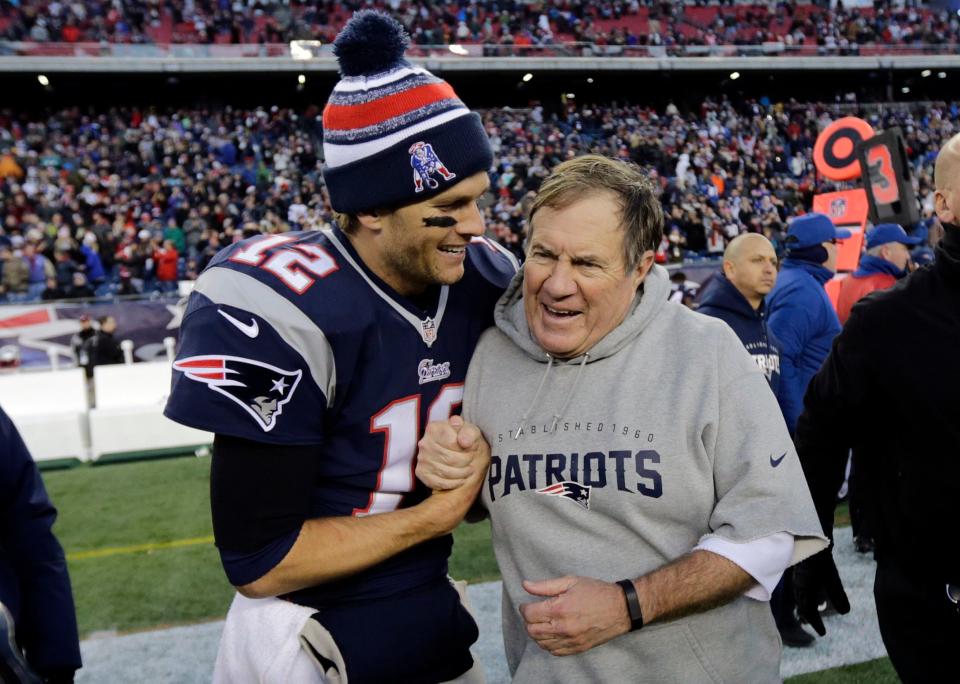 FILE - New England Patriots quarterback Tom Brady, left, celebrates with head coach Bill Belichick after defeating the Miami Dolphins 41-13 in an NFL football game Sunday, Dec. 14, 2014, in Foxborough, Mass. Six-time NFL champion Bill Belichick has agreed to part ways as the coach of the New England Patriots on Thursday, Jan. 11, 2024, bringing an end to his 24-year tenure as the architect of the most decorated dynasty of the league’s Super Bowl era, a source told the Associated Press on the condition of anonymity because it has not yet been announced. (AP Photo/Charles Krupa, File)
