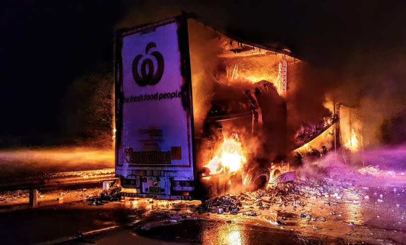 The Woolworths truck on fire on the Hume Highway on Tuesday morning.