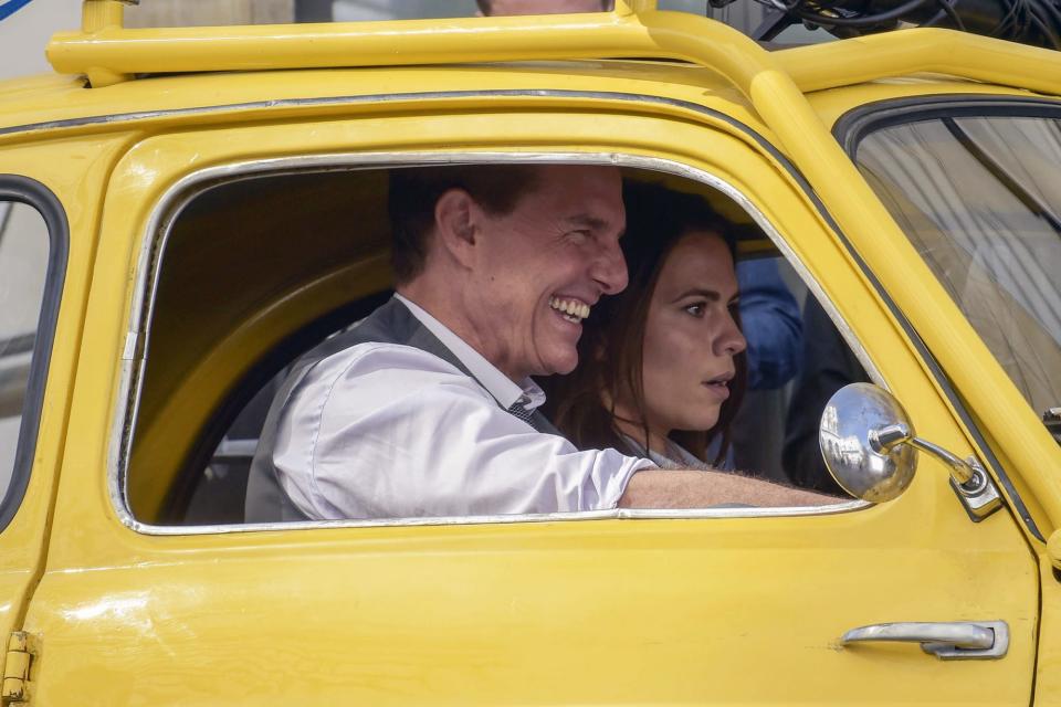 <p>Tom Cruise and costar Hayley Atwell are seen filming<i> Mission Impossible 7</i> in a yellow Fiat 500 in Rome on Friday. </p>