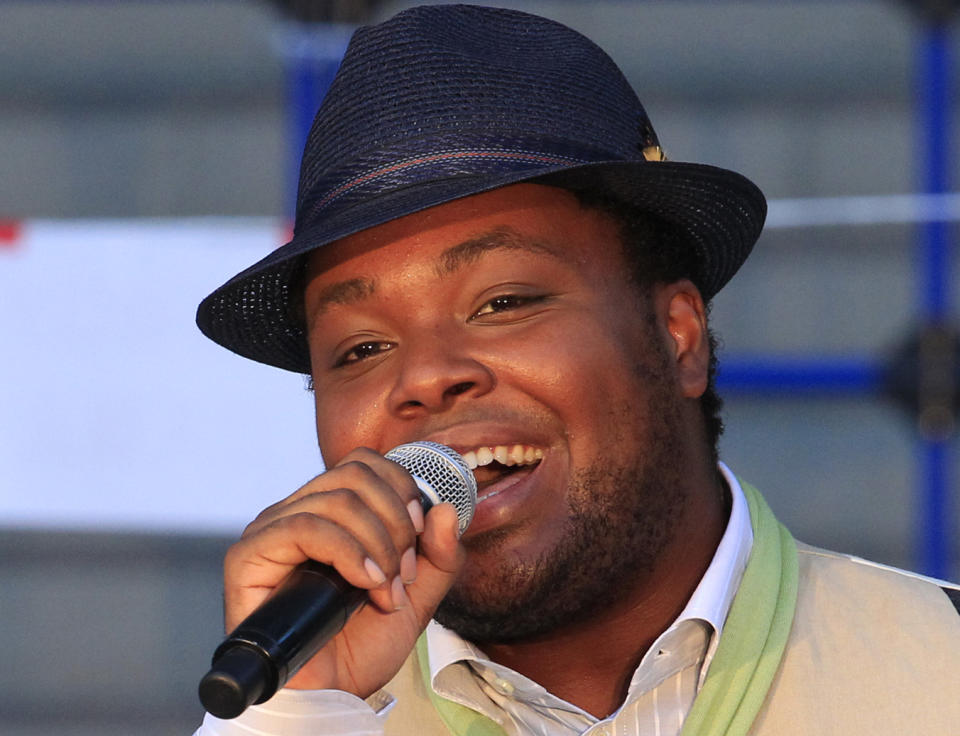 In this photo taken Monday, Aug. 5, 2013, San Francisco-born Chris Hart sings at an outdoor concert in Tokyo. His album of cover versions of Japanese pop tunes is rising on the charts. And the crooner is scoring on this nation's equivalent of “American Idol,” being billed as a genius who understands the “soul” of Japan. (AP Photo/Azusa Uchikura)