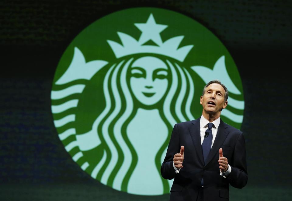 Howard Schultz, chairman and CEO of Starbucks Coffee Company, speaks Wednesday, March 19, 2014, at the company's annual shareholders meeting in Seattle. (AP Photo/Ted S. Warren)