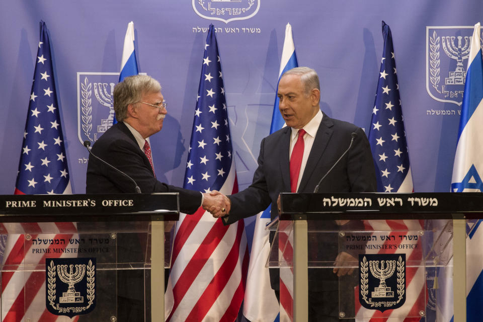 Israeli Prime Minister Benjamin Netanyahu, right, shakes hands with U.S. National Security Advisor John Bolton in Jerusalem, Sunday, June 23, 2019. (AP Photo/Tsafrir Abayov, Pool)