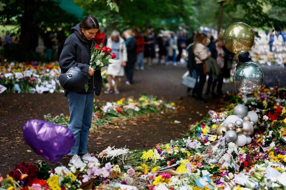 People view flowers at a memorial site in Green Park near Buckingham Palace following the death of Queen Elizabeth II  on September 16, 2022.