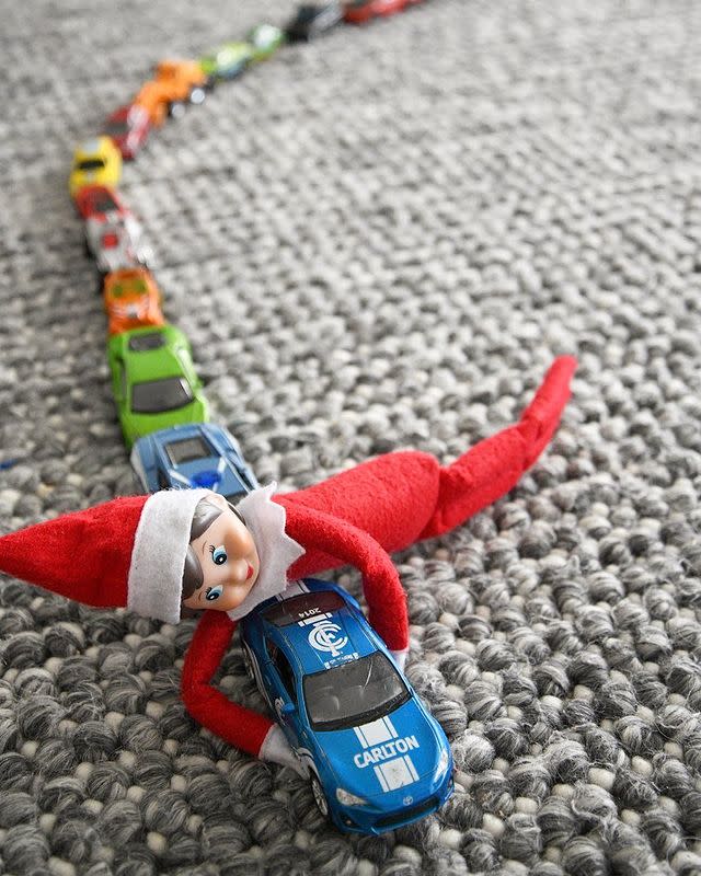 Elf on the Shelf Playing With Matchbox Cars