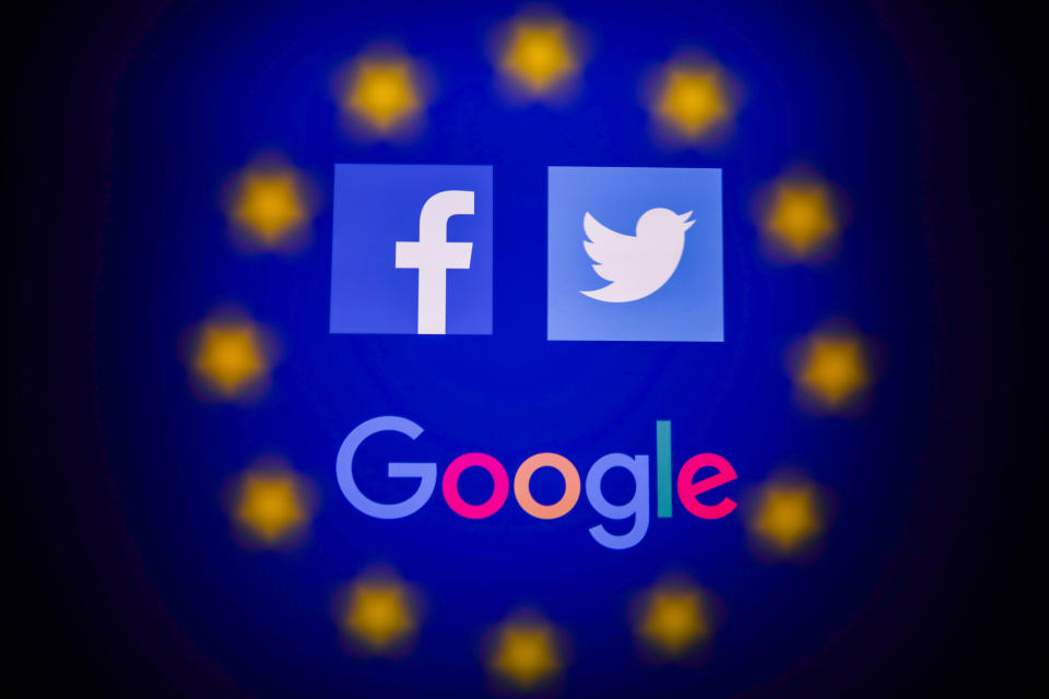 Facebook, Twitter and Google logos displayed on a phone screen and European Union flag displayed on a screen in the background are seen in this multiple exposure illustration photo taken in Poland on June 14, 2020. European Commission officials said that Facebook, Twitter and Google should provide monthly fake news reports to prevent fake news about coronavirus pandemic. (Photo Illustration by Jakub Porzycki/NurPhoto via Getty Images)