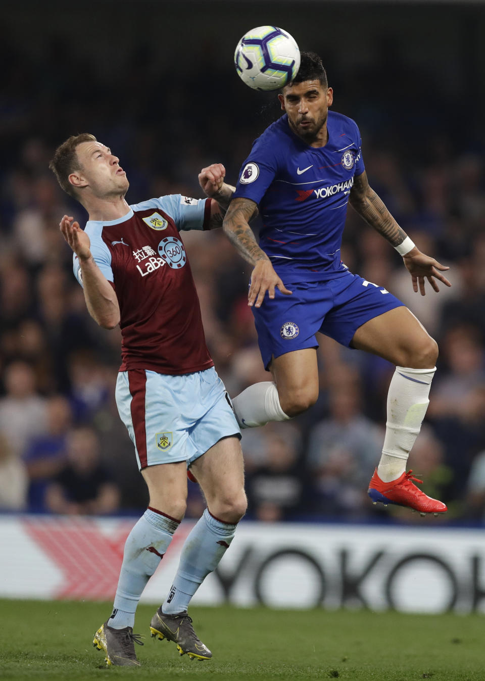 Chelsea's Emerson, right, vies for the ball with Burnley's Ashley Barnes during the English Premier League soccer match between Chelsea and Burnley at Stamford Bridge stadium in London, Monday, April 22, 2019. (AP Photo/Kirsty Wigglesworth)