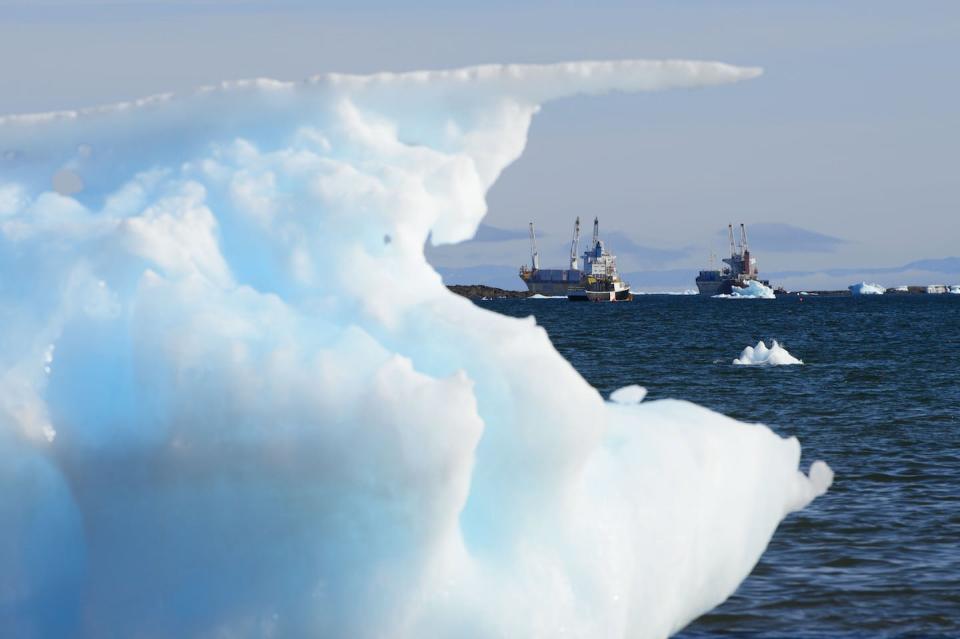 Ships are framed by pieces of melting sea ice in Frobisher Bay in Iqaluit, Nunavut in July 2019. THE CANADIAN PRESS/Sean Kilpatrick