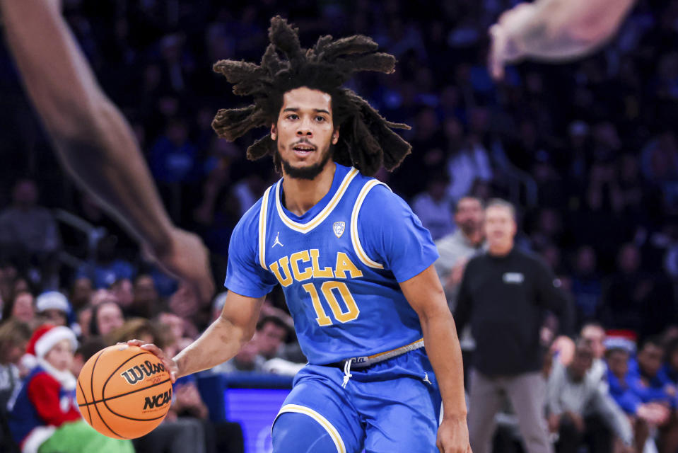 UCLA guard Tyger Campbell (10) dribbles the ball during the second half of an NCAA college basketball game against Kentucky in the CBS Sports Classic, Saturday, Dec. 17, 2022, in New York. The Bruins won 63-53. (AP Photo/Julia Nikhinson)