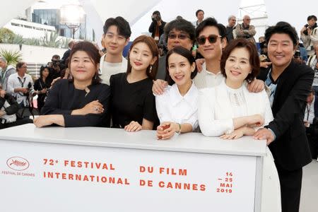 FILE PHOTO: 72nd Cannes Film Festival - Photocall for the film "Parasite" (Gisaengchung) in competition - Cannes, France, May 22, 2019. Director Bong Joon-ho poses with cast members. REUTERS/Eric Gaillard