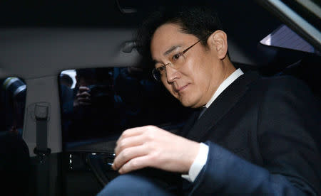 Samsung Group chief, Jay Y. Lee, leaves for the Seoul Central District Court at the office of the independent counsel in Seoul, South Korea, February 16, 2017. Koo Yoon-sung/News1 via REUTERS