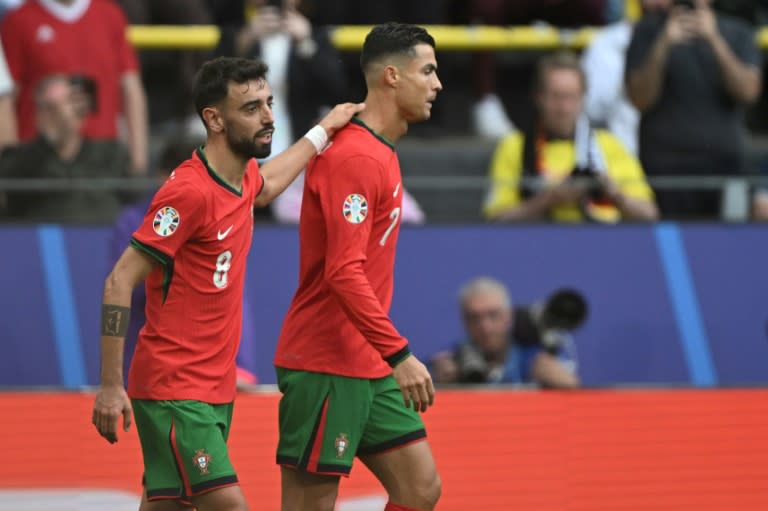 Bruno Fernandes and Cristiano Ronaldo celebrate together after the duo combined for Portugal's third goal in their 3-0 win over Turkey at Euro 2024 (PATRICIA DE MELO MOREIRA)