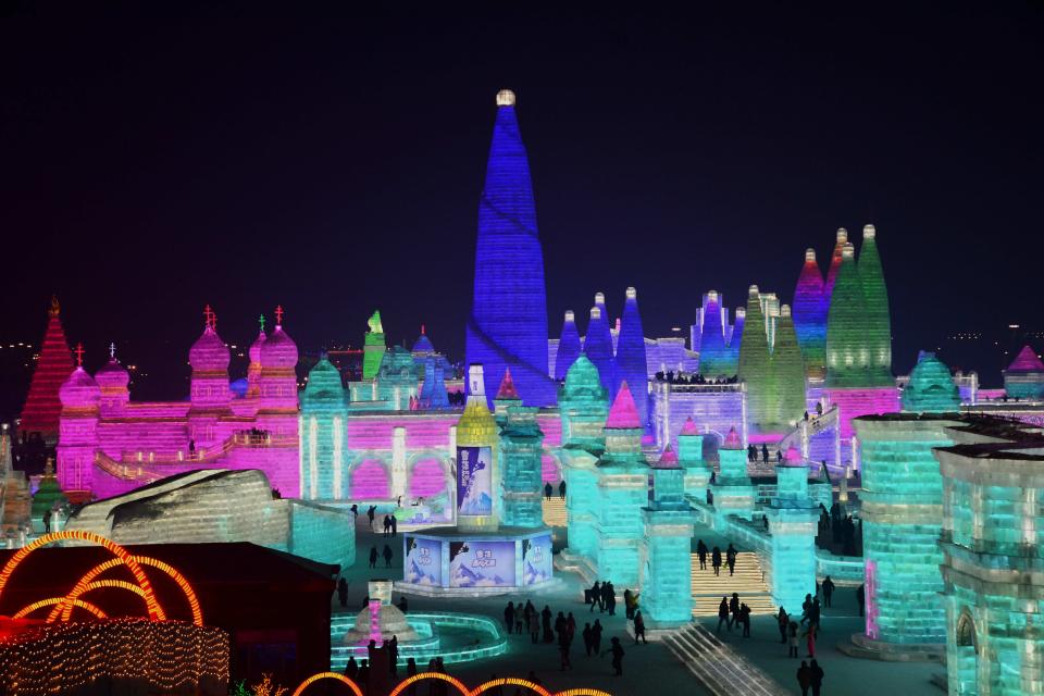 <p>Tourists enjoy spectacular ice and snow sculptures at the Harbin Ice and Snow World park in Harbin, China, on Jan. 2. (Photo: Sipa Asia/REX/Shutterstock) </p>