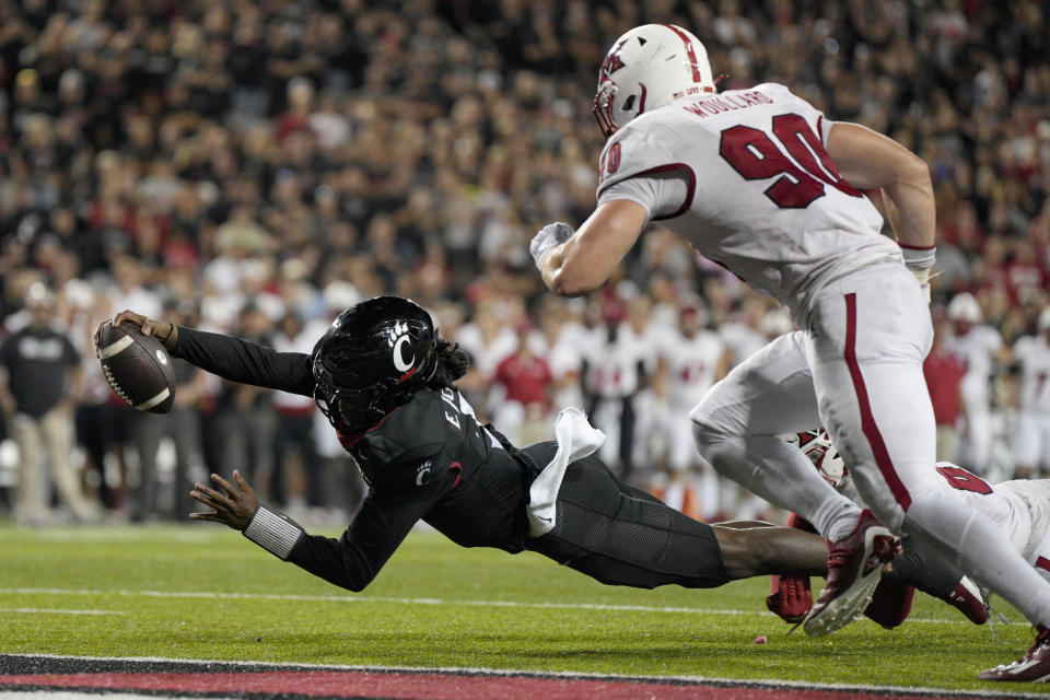 Cincinnati quarterback Emory Jones (5) comes up short of the end zone during overtime of an NCAA college football game against Miami (Ohio), Saturday, Sept. 16, 2023, in Cincinnati. (AP Photo/Jeff Dean)