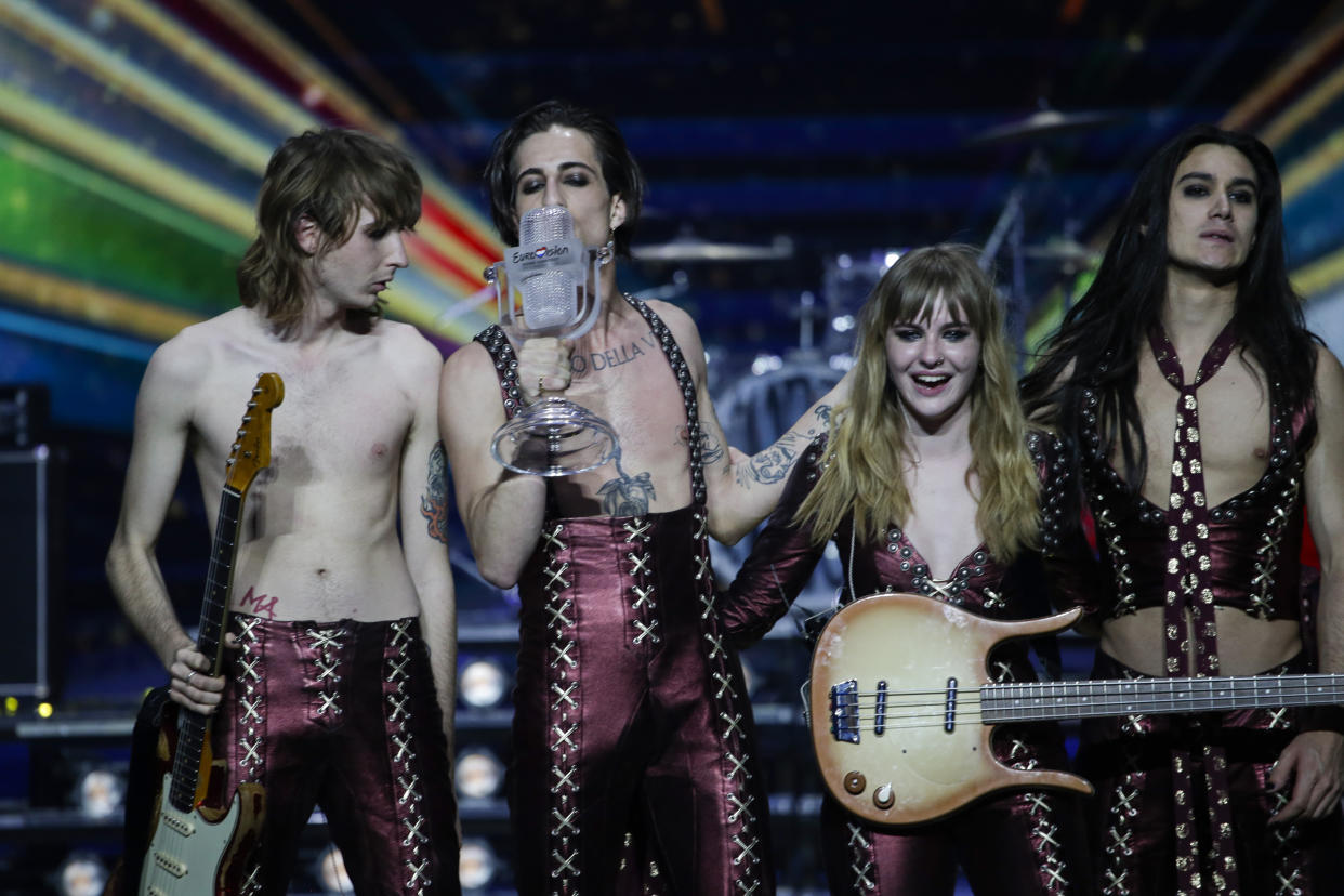 Members of the Maneskin from Italy Thomas Raggi, from left, Damiano David, Victoria De Angelis and Ethan Torchio pose on stage with the trophy after winning the Grand Final of the Eurovision Song Contest at Ahoy arena in Rotterdam, Netherlands, Saturday, May 22, 2021. (AP Photo/Peter Dejong)