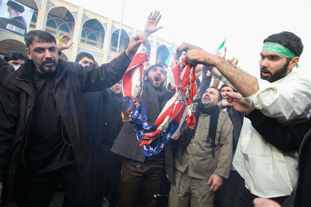 Iranians burn a US flag during a demonstration in Tehran following the killing of top military commander Qasem Soleimani: AFP via Getty Images