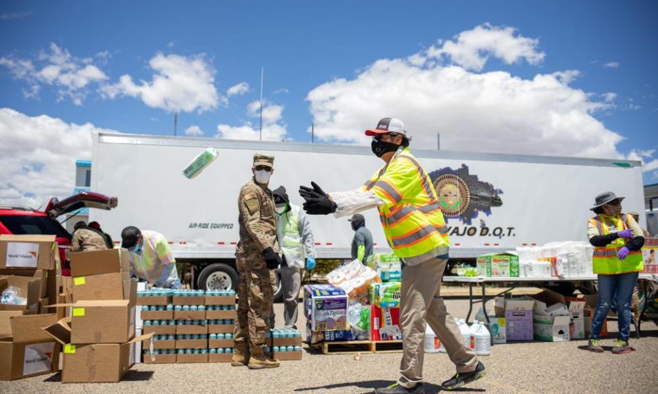 Navajo Nation President Jonathan Nez helps distribute food, water, and other supplies to Navajo families in Huerfano, New Mexico on May 27.