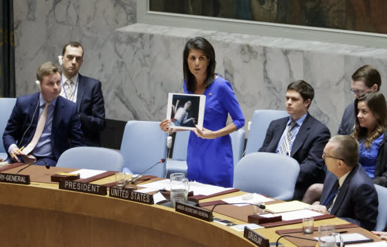 Justin Lane-EPANikki Haley, the U.S. Ambassador to the U.N., holds up pictures of victims of a chemical attack in Syria during an emergency meeting of the United Nations Security Council at the United Nations in New York on April 5, 2017.