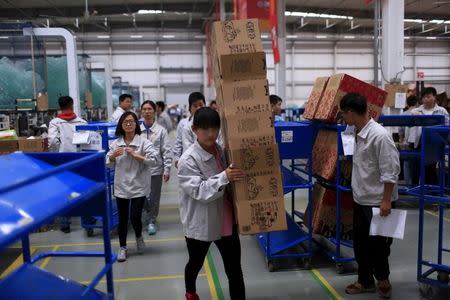 Employees work at a Tmall logistic centre in Suzhou, Jiangsu province, China, October 28, 2015. REUTERS/Aly Song