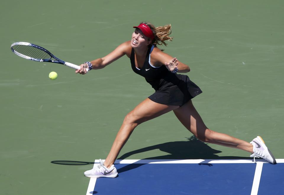 Danielle Rose Collins of the U.S. lunges to hit a return to Simona Halep of Romania during their match at the 2014 U.S. Open tennis tournament in New York, August 25, 2014. REUTERS/Mike Segar (UNITED STATES - Tags: SPORT TENNIS)