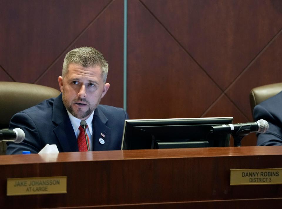 Volusia County Councilman Danny Robins watches from the dais during a swearing into office ceremony at the County Council chambers in DeLand on Thursday, Jan. 5, 2023.