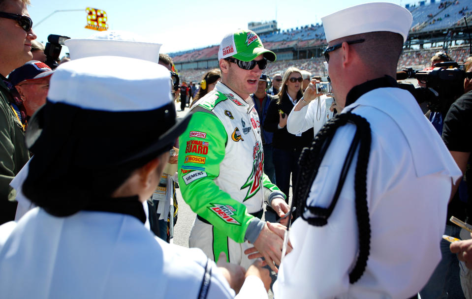 TALLADEGA, AL - OCTOBER 22: Dale Earnhardt Jr., driver of the #88 Diet Mountain Dew Chevrolet, greets members of the military during qualifying for the NASCAR Sprint Cup Series Good Sam Club 500 at Talladega Superspeedway on October 22, 2011 in Talladega, Alabama. (Photo by Jeff Zelevansky/Getty Images for NASCAR)