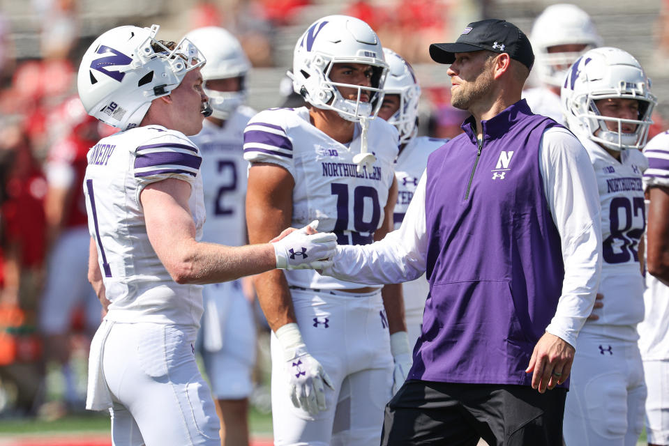 Sept. 3, 2023; Piscataway, New Jersey; Northwestern Wildcats interim coach David Braun shakes hands with Northwestern Wildcats wide receiver Jack Kennedy (1) before the game at SHI Stadium. Vincent Carchietta-USA TODAY Sports