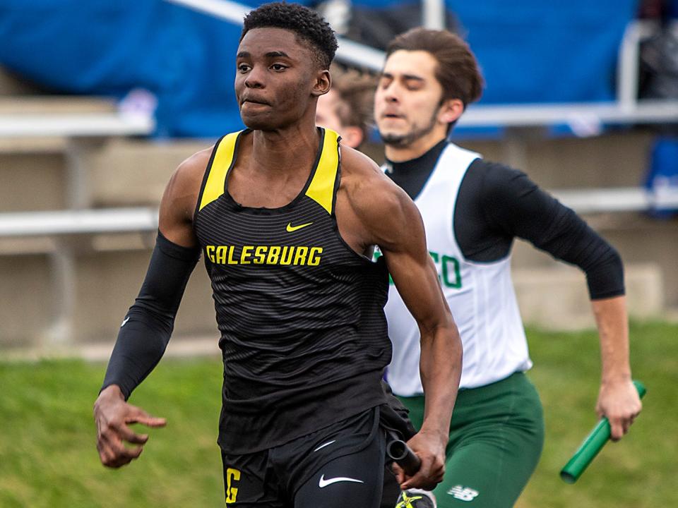 Galesburg senior Adrian Outlaw runs the second leg of the 4x1 meter relay during the Streak ABC Invitational on Friday, April 15, 2022 at Van Dyke Field.