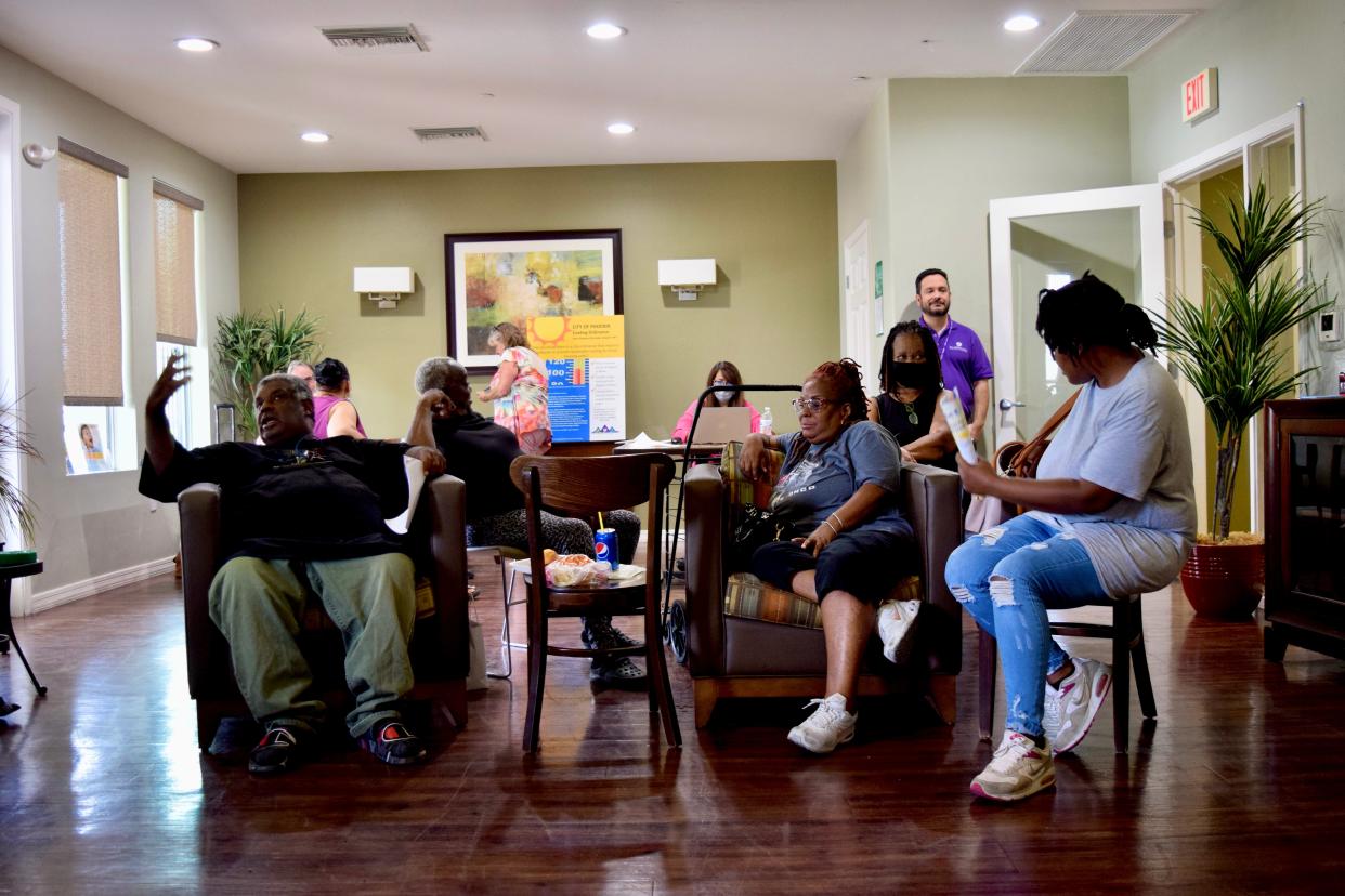 Residents of Grandfamilies Place wait in the Grandfamilies Place clubhouse to receive rental and utility assistance from the City of Phoenix Human Services Department on July 21, 2022.