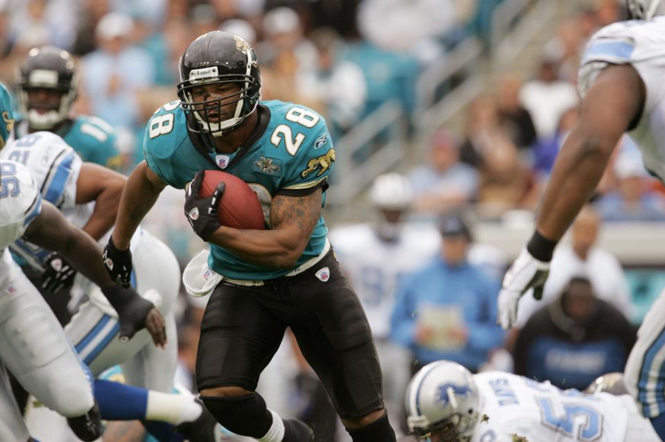 Jacksonville Jaguars legendary running back Fred Taylor (28), seen here running in a 23-17 overtime win over the Detroit Lions in 2004, received his college diploma last week from the University of Florida, 26 years after leaving the Gators for the NFL.