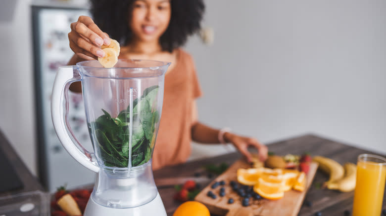 smoothie being made with spinach 