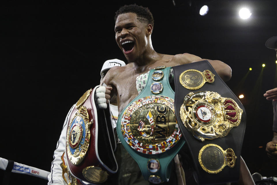 United States' Devin Haney displays his belts after defeating George Kambosos Jr. of Australia as Haney defends his undisputed lightweight boxing title in Melbourne, Sunday, Oct. 16, 2022. (AP Photo/Hamish Blair)