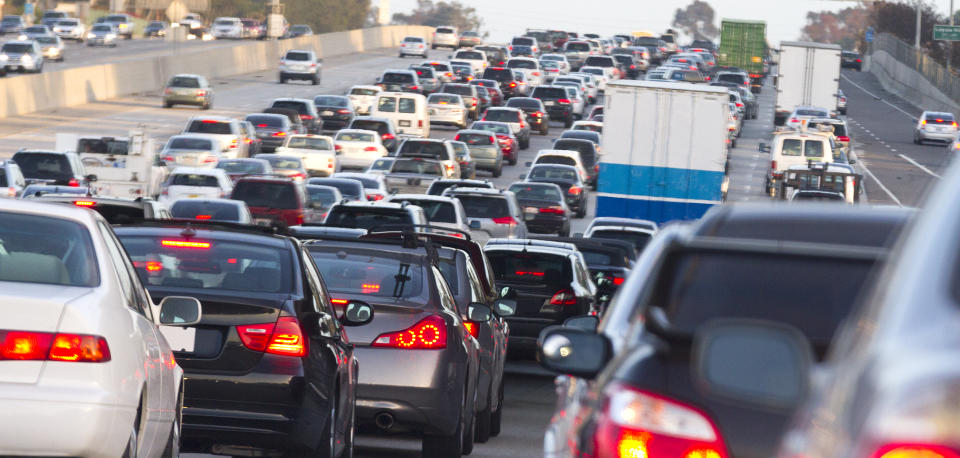 If you own more than one car or are renting a car, AAA says to use the most fuel-efficient vehicle for long hauls. (Photo: Getty)