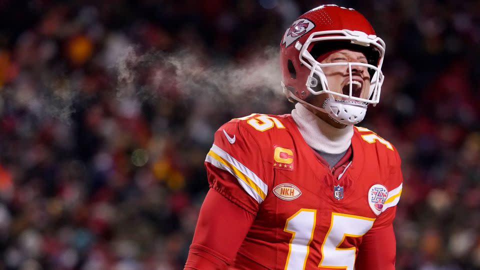 Mahomes celebrates after throwing a touchdown pass during the first half of the Chiefs' Wild Card playoff victory over the Miami Dolphins. - Ed Zurga/AP