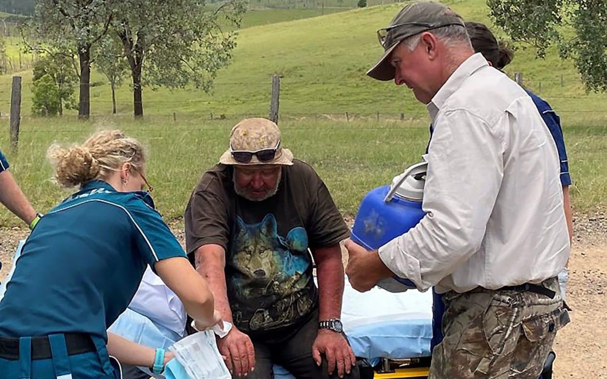 Paramedics give medical treatment to Robert Weber who went missing for more than two weeks in Australian bushland of Kilkivan - -/AFP