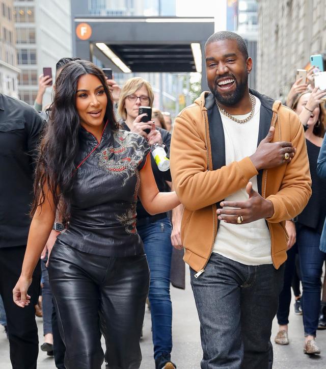 Kim Kardashian & Kanye West Put On Affectionate Display At Son Saint's  Basketball Game