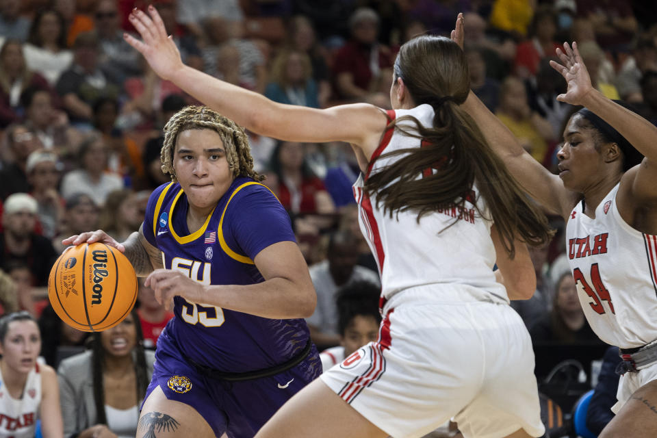 LSU's Kateri Poole (55) drives against Utah's Jenna Johnson and Dasia Young (34) during the first half of a Sweet 16 college basketball game in the women's NCAA Tournament in Greenville, S.C., Friday, March 24, 2023. (AP Photo/Mic Smith)