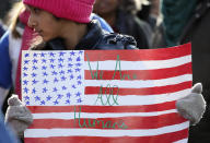 <p>A girl holds a sign during the Second Annual Womens March in Chicago, Ill. (Photo: Jim Young/AFP/Getty Images) </p>