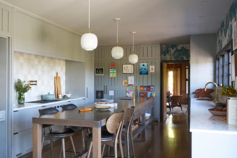 Bar stools surround large kitchen island.