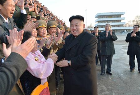 North Korean leader Kim Jong Un visits participants of a national agriculture competition in this undated photo released by North Korea's Korean Central News Agency (KCNA) in February 10, 2014. North Korean security chiefs and possibly even Supreme Leader Kim Jong-un himself should face international justice for ordering systematic torture, starvation and killings comparable to Nazi-era atrocities, U.N. investigators said on February 17, 2014. REUTERS/KCNA/File