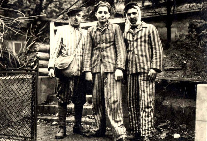 Three Polish Jewish men who were liberated by the Red Army are seen after the liberation of Nazi German death camp Auschwitz-Birkenau in Nazi-occupied Poland, in this undated handout picture